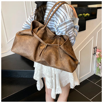 Person holding a Trendy Large Fashion Tote in a kitchen setting