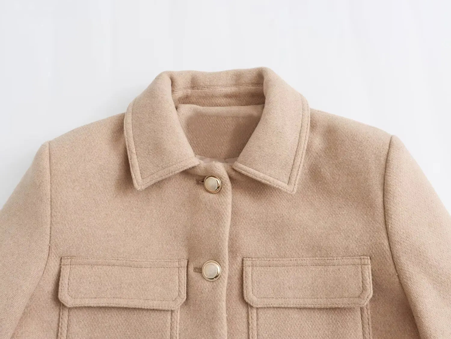 Beige jacket with collar and button details on a light gray background