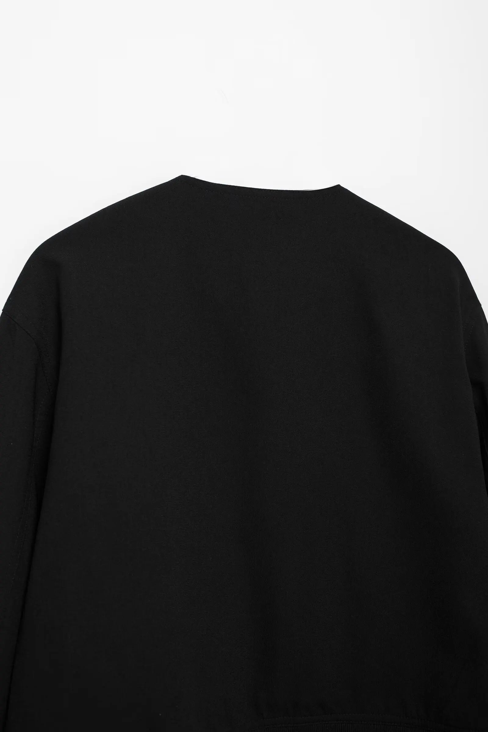 Black long-sleeve shirt on a white background