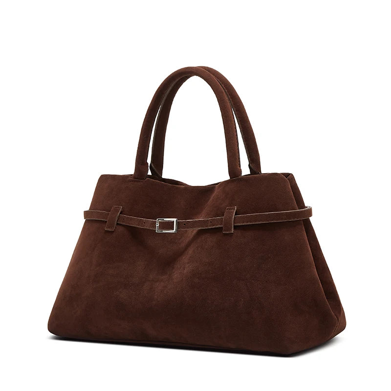 Brown handbag with a belt detail on a white background