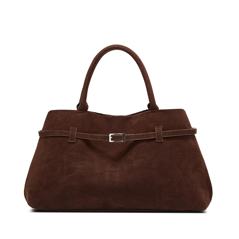 Brown handbag with a strap on a white background