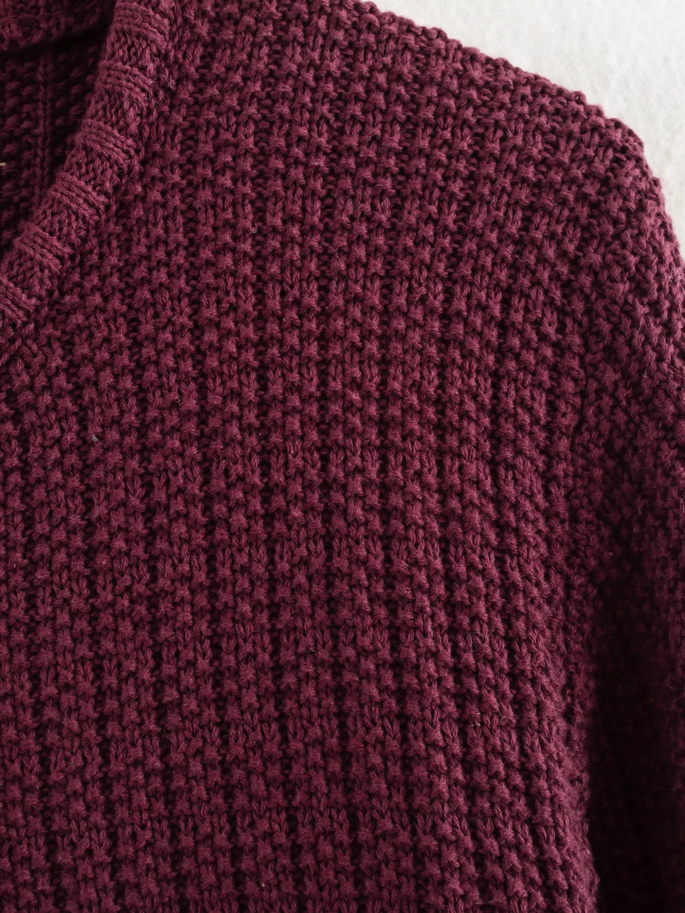 Close-up of a textured burgundy sweater
