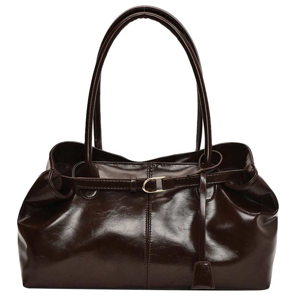 Brown leather handbag on a white background