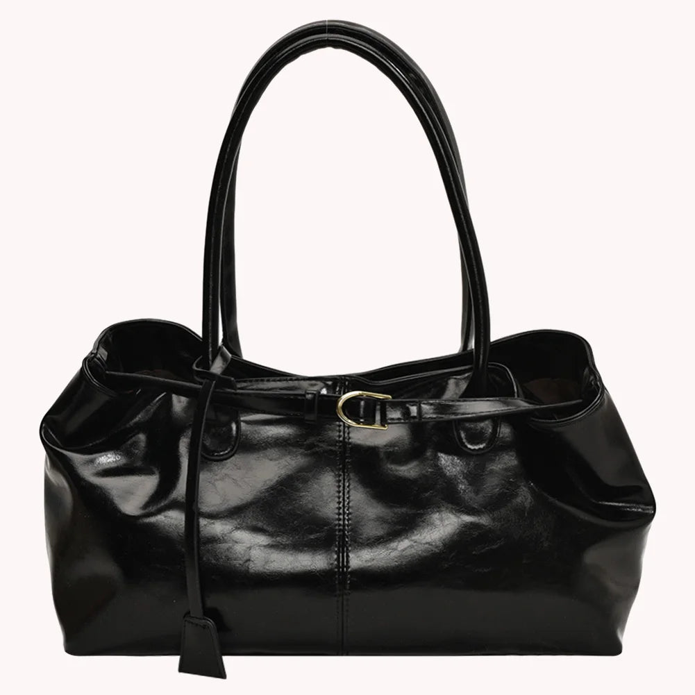 Black leather handbag on a white background