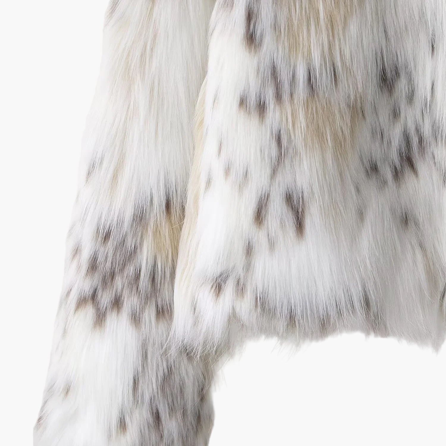 Close-up of a fur texture with white, brown, and black colors on a light gray background.