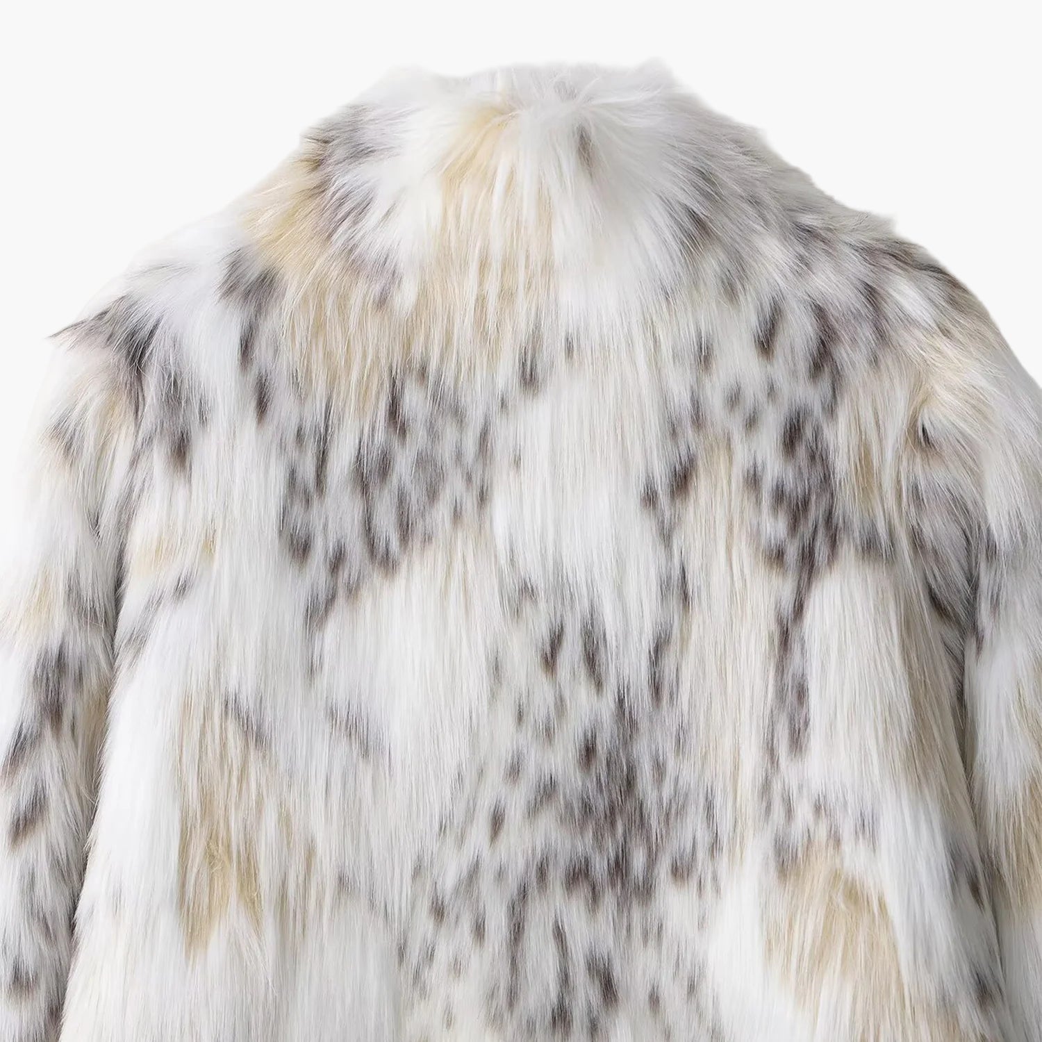 Close-up of a fur coat with a white and brown pattern on a light background