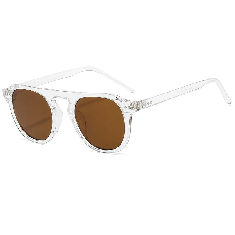 Clear frame sunglasses with brown lenses on a white background Steampunk Oval Rivet Shades – Retro Gothic Industrial Goggles
