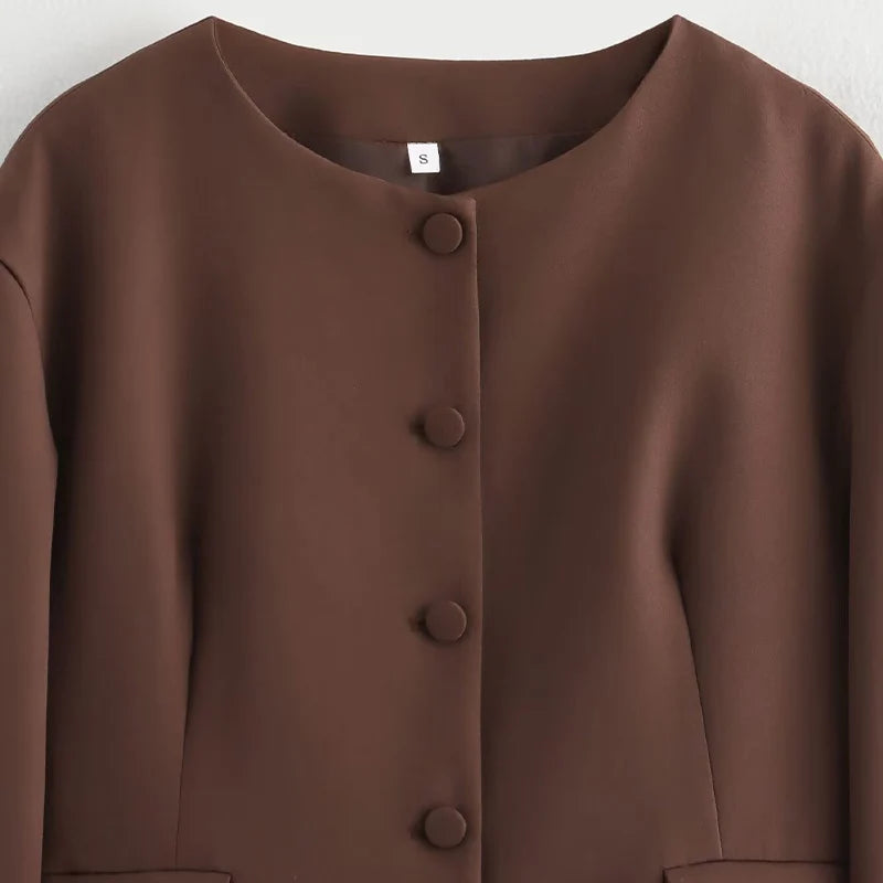 Brown button-up garment on a white background