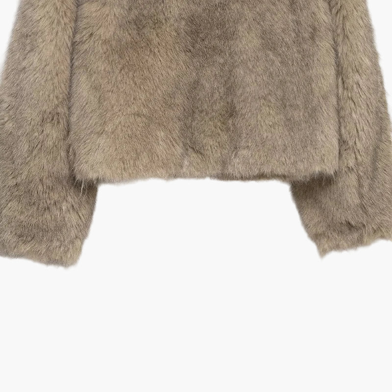 Close-up of a brown fur jacket on a white background