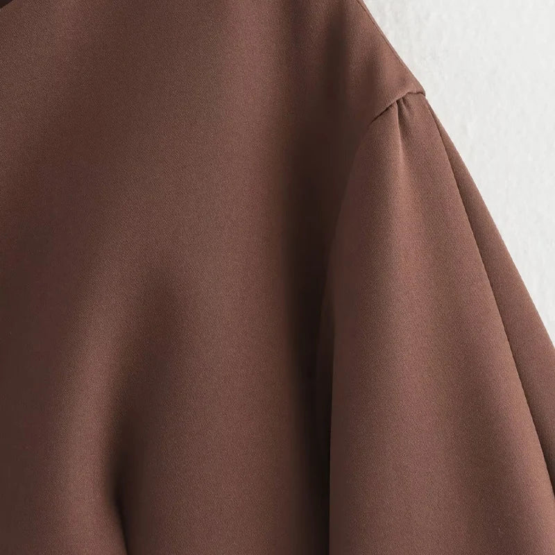 Brown fabric with a textured surface on a white background