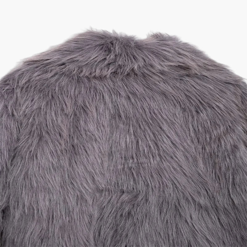 Close-up of a gray fluffy pillow on a white background