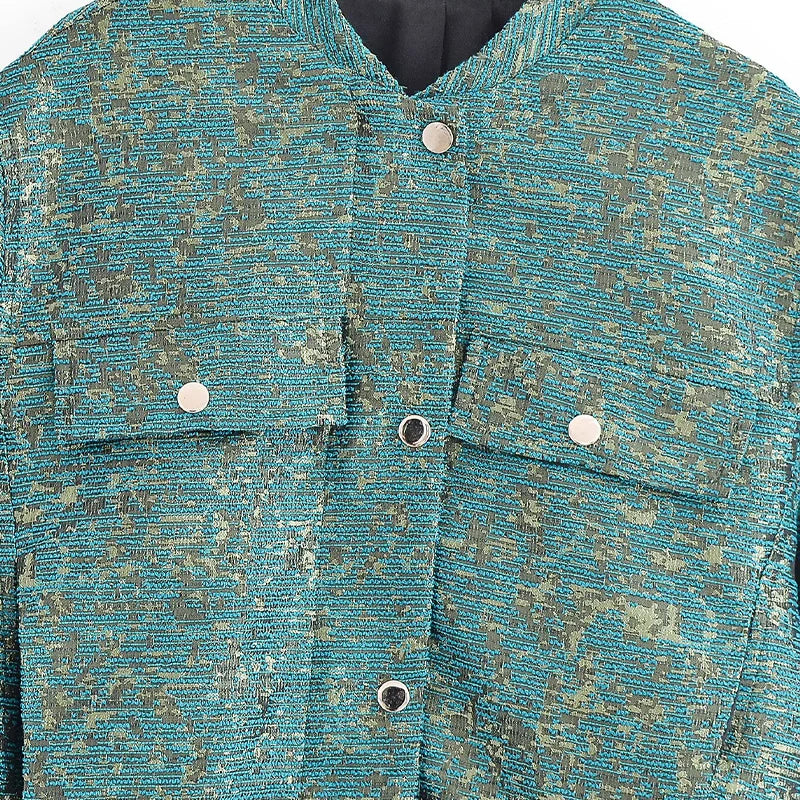 Close-up of a textured blue jacket with button details