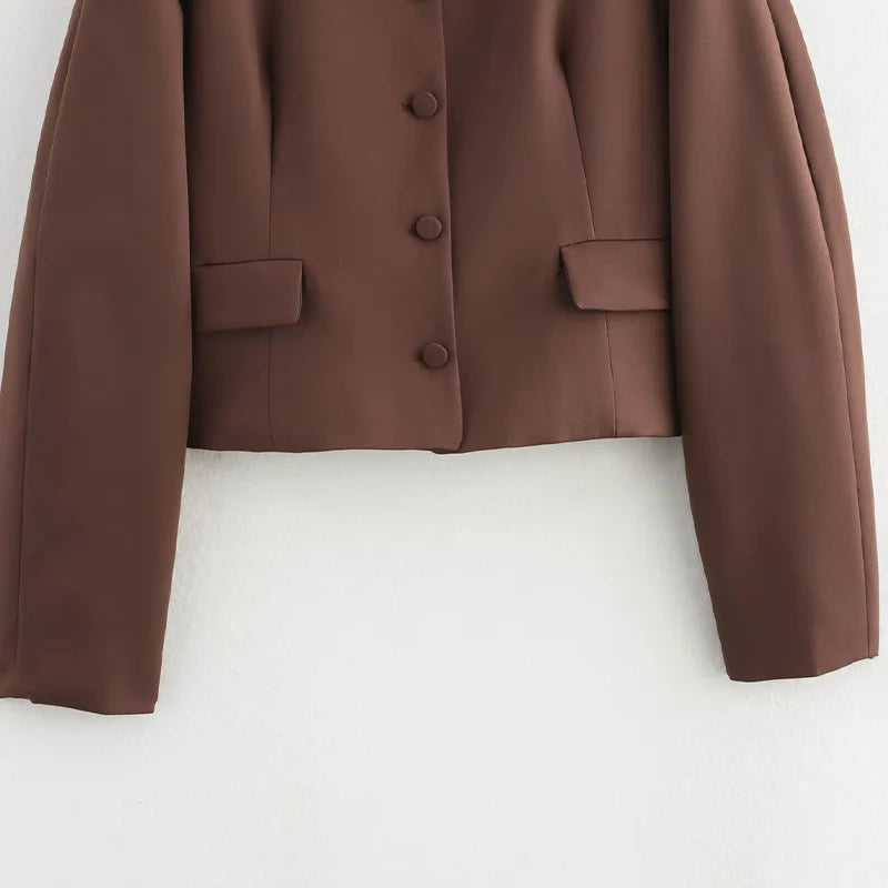 Brown jacket with buttons on a white background