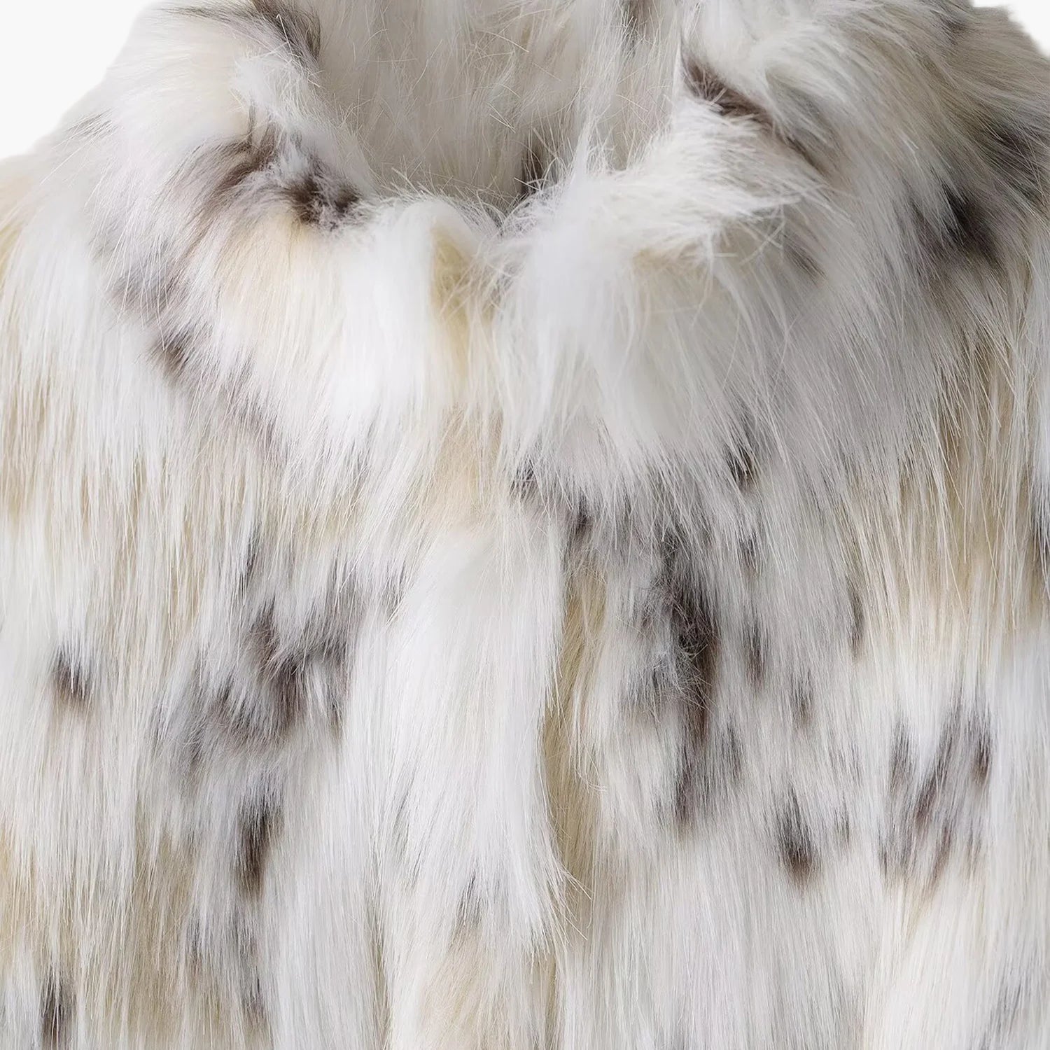 Close-up of white fur with brown patches