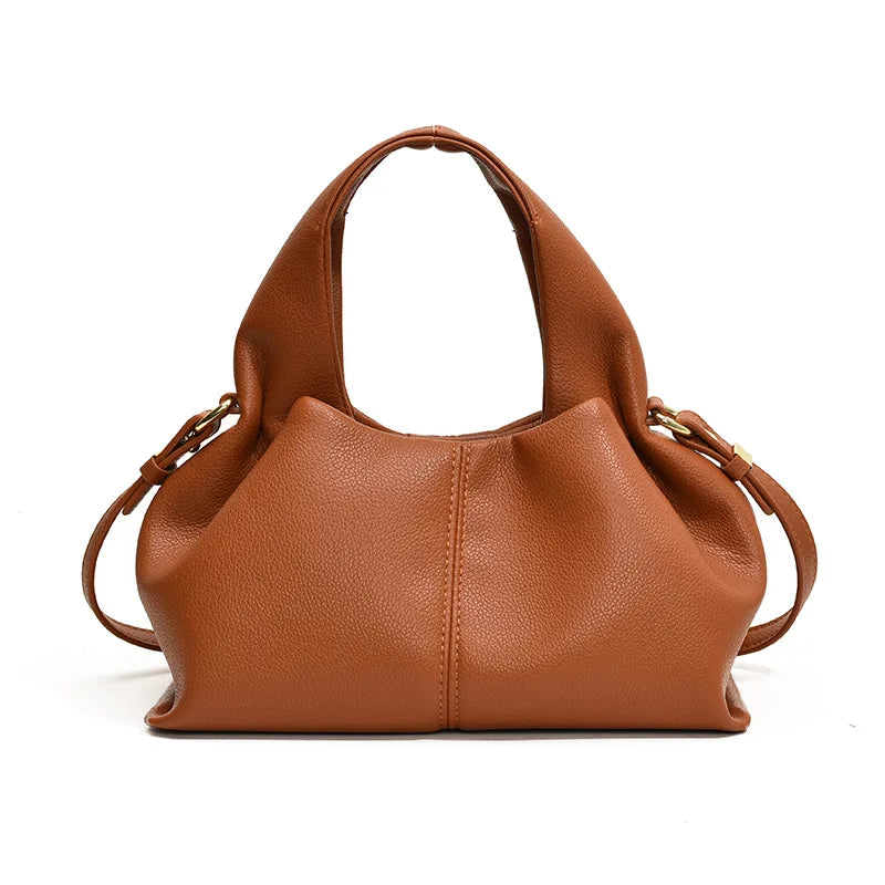 Brown leather handbag on a white background