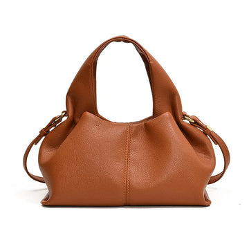 Brown leather handbag on a white background