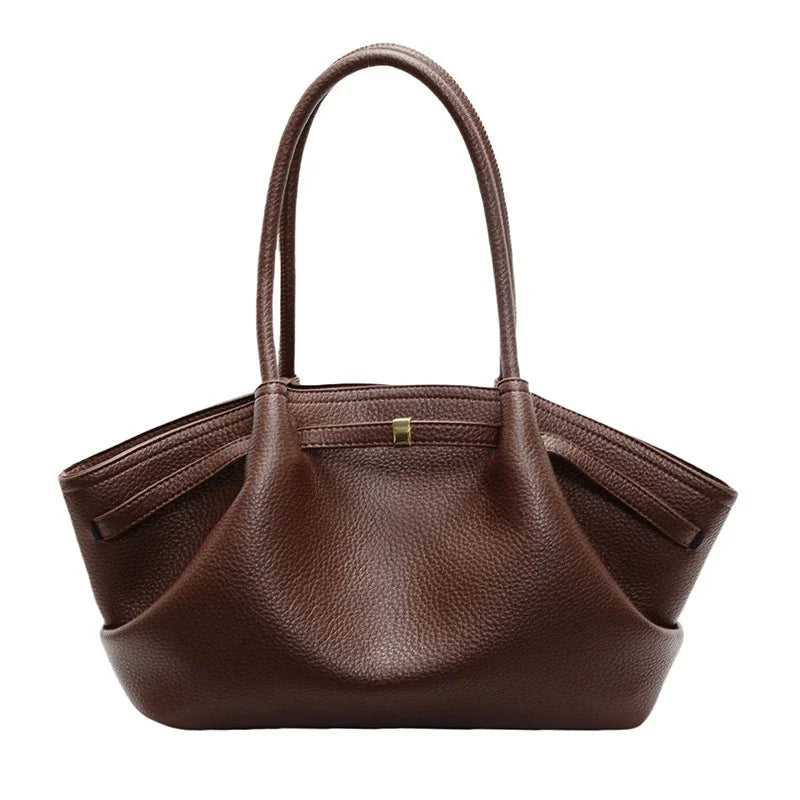 Coffee leather handbag on a white background