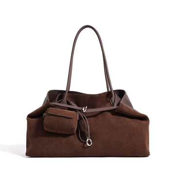 Brown handbag with a strap on a white background