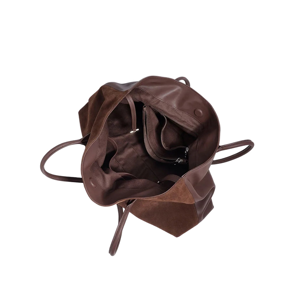Brown leather bag on a white background