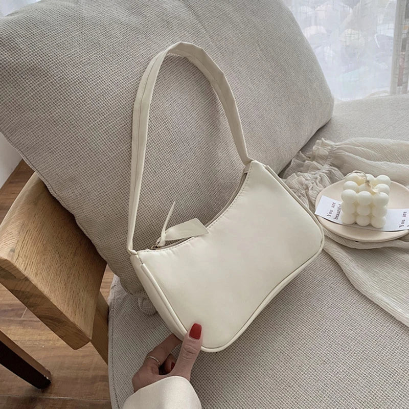 Woman holding classic retro bow leather handbag