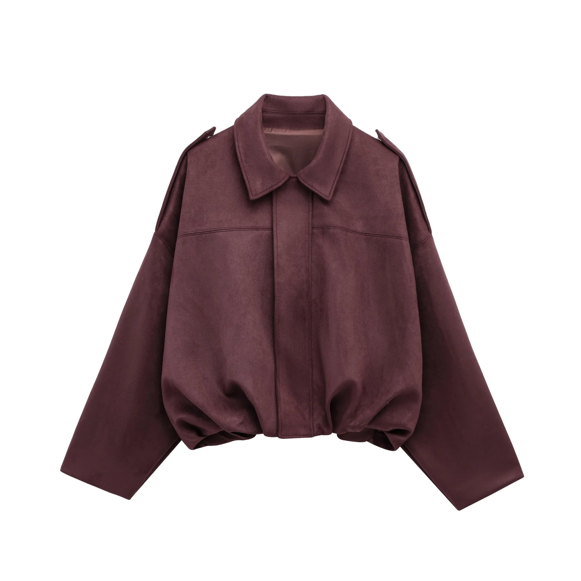 Detail of sleeve and suede texture on cropped bomber jacket