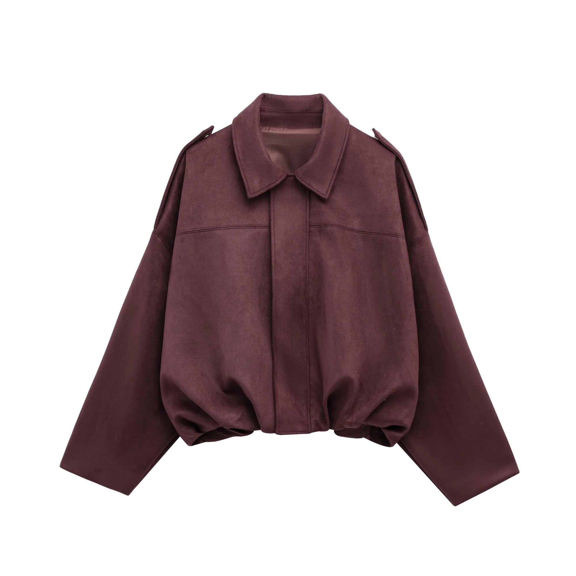 Detail of sleeve and suede texture on cropped bomber jacket