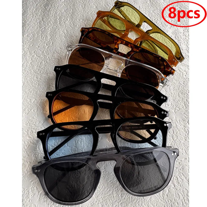 Set of eight pairs of sunglasses in various colors displayed on a Steampunk Oval Rivet Shades – Retro Gothic Industrial Goggles
