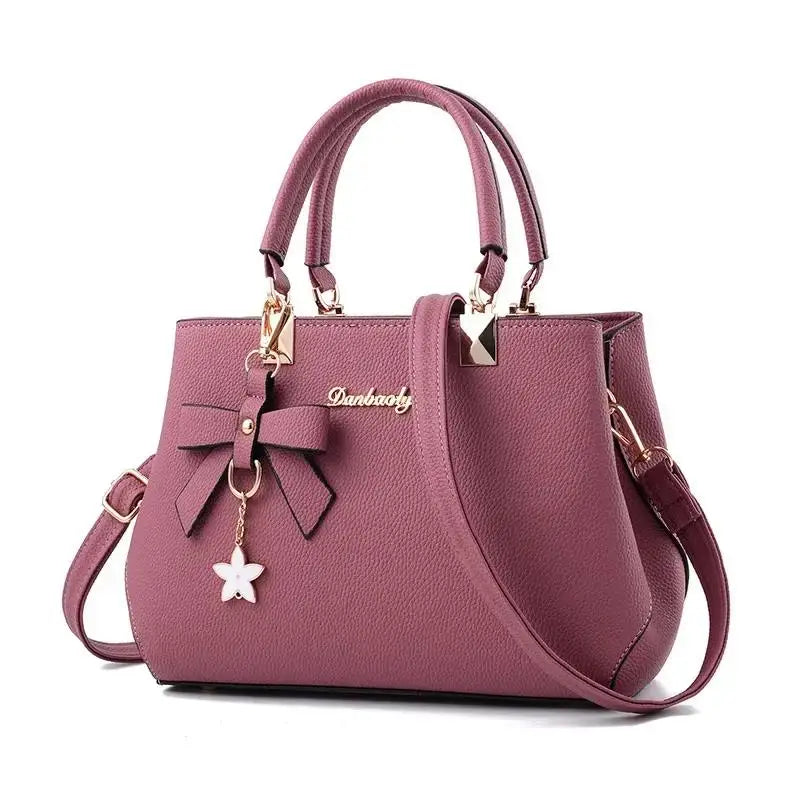 Blossom charm messenger bag in soft pink floral print