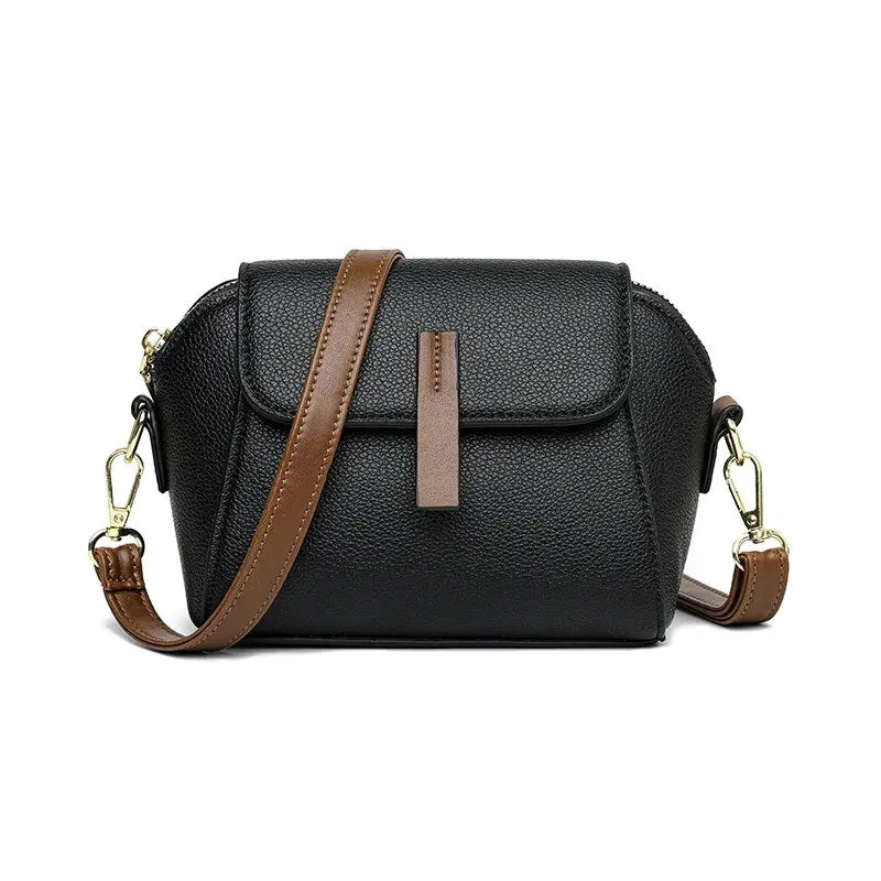 Model wearing chic everyday crossbody bag with blazer