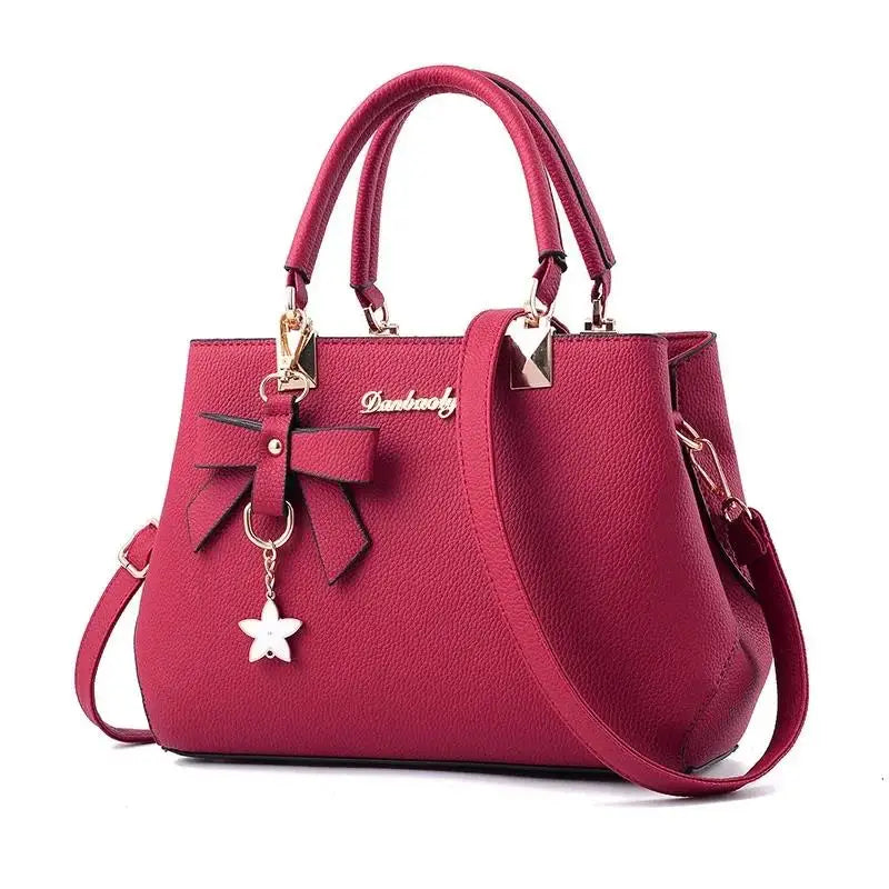 model wearing blossom charm messenger bag with dress