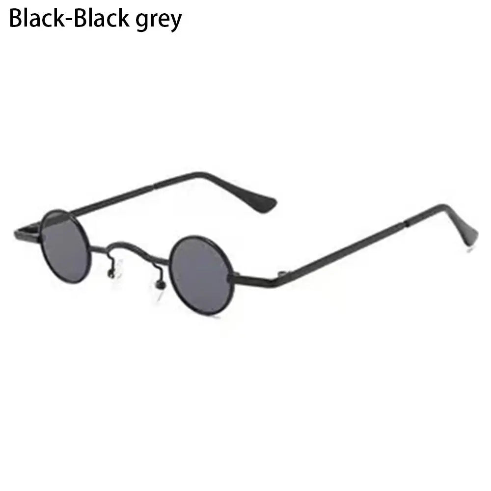 Candy Round Metal Shades, Round black sunglasses with thin black frames on a Candy Round Metal Shades