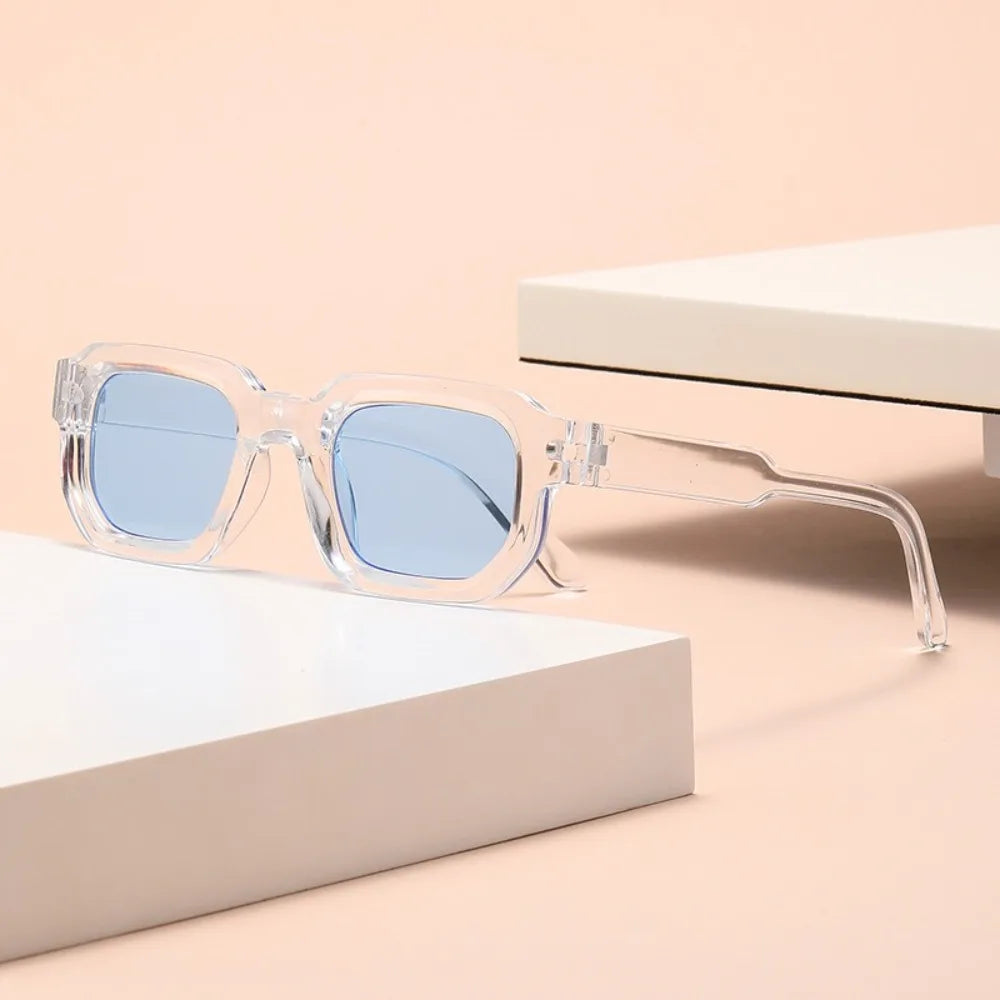 Sunglasses with clear frame and blue lenses on Leopard Punk Square Shades