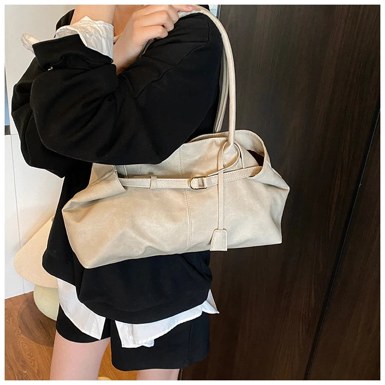 Person holding a Trendy Large Fashion Tote with a neutral background