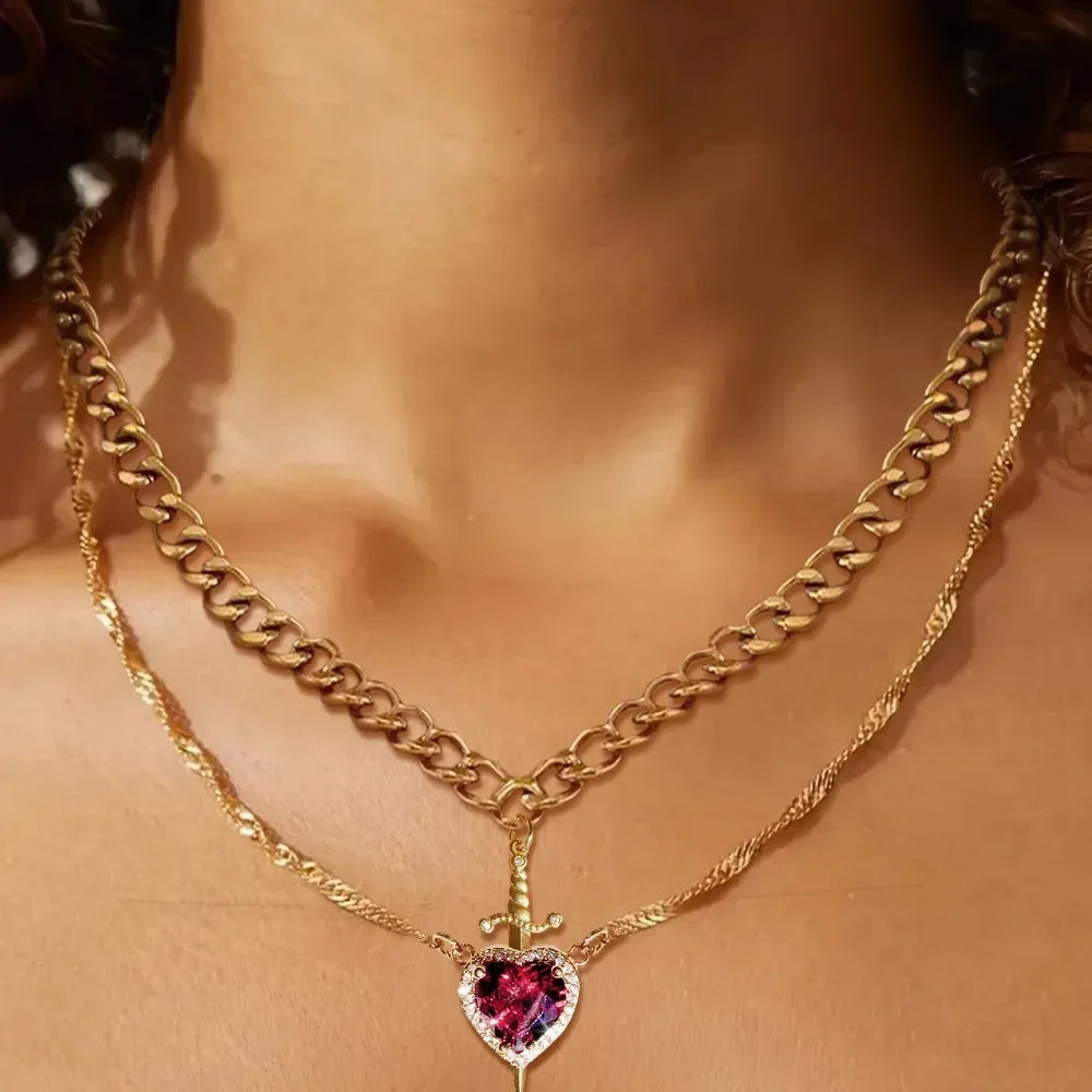 Heart & Sword Couple Necklaces Model wearing an elegant pearl necklace 