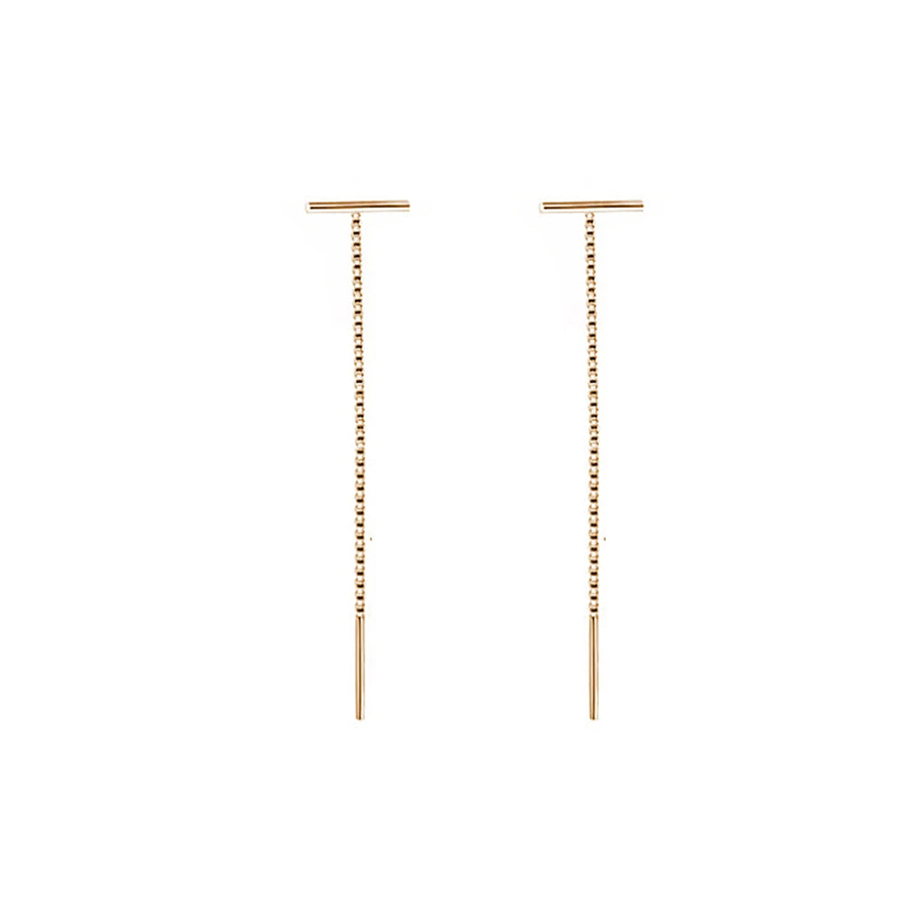 Gold earrings with dangling beads on a white background and Silver Minimalist Tassel Earrings