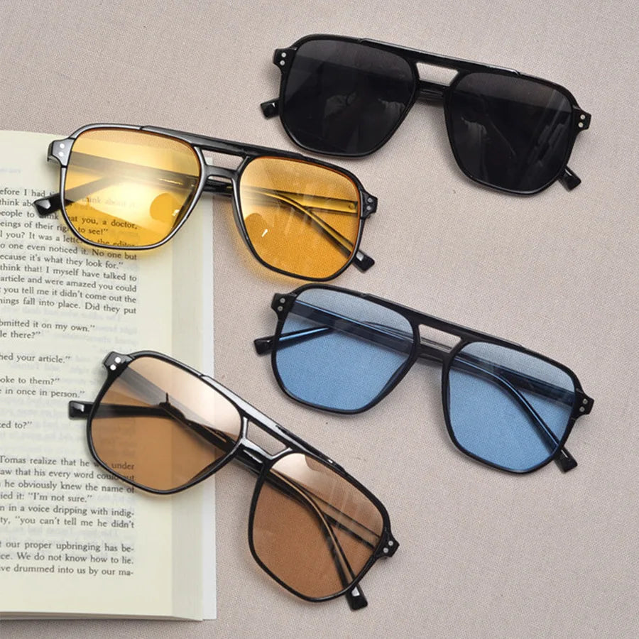 Three pairs of sunglasses with different colored lenses on a Vintage Square Glow Shades.