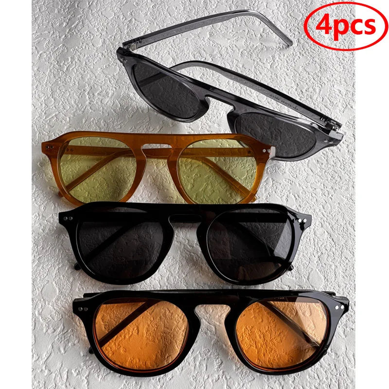 Set of four pairs of sunglasses with different lens colors on a Steampunk Oval Rivet Shades – Retro Gothic Industrial Goggles
