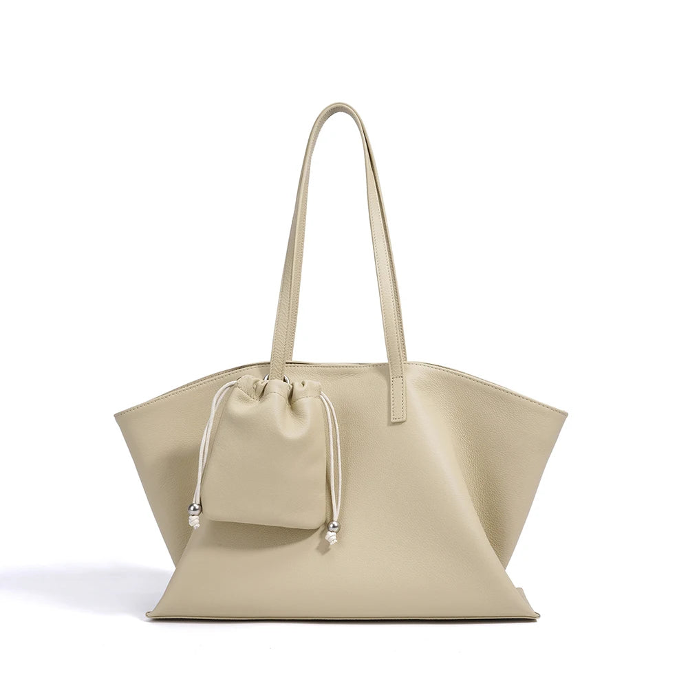 Beige handbag with a matching pouch on a white background