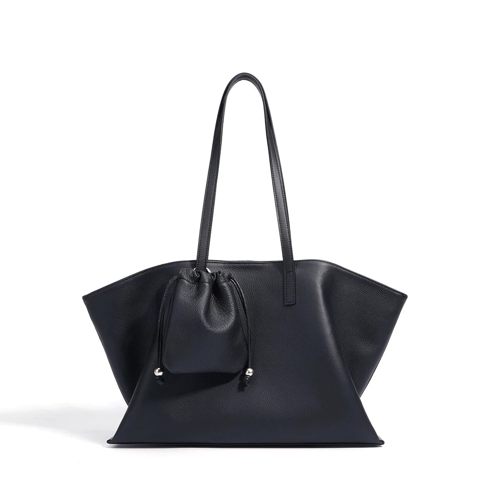 Black handbag with a drawstring detail on a white background