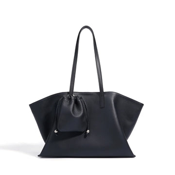 Black handbag with a drawstring detail on a white background