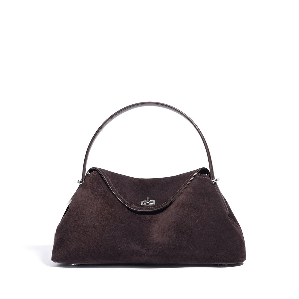 Brown handbag with a metal handle on a white background