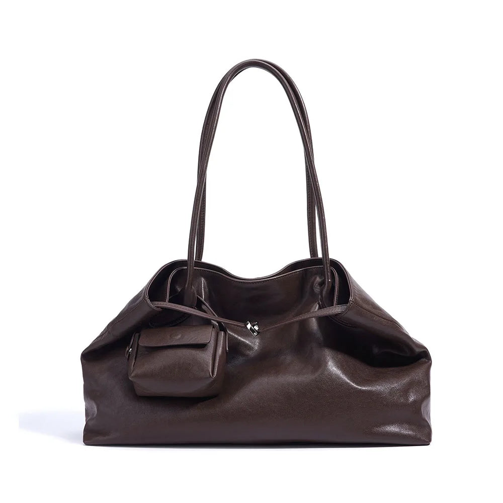 Brown leather handbag with a shoulder strap on a white background
