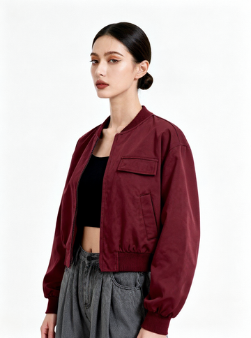 Woman wearing a burgundy jacket on a white background