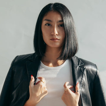 model-with-leather-jacket-over-shoulders